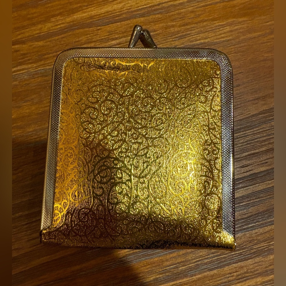 VNTG kiss lock makeup mirror gold foil design and a kiss-lock closure 1960’s